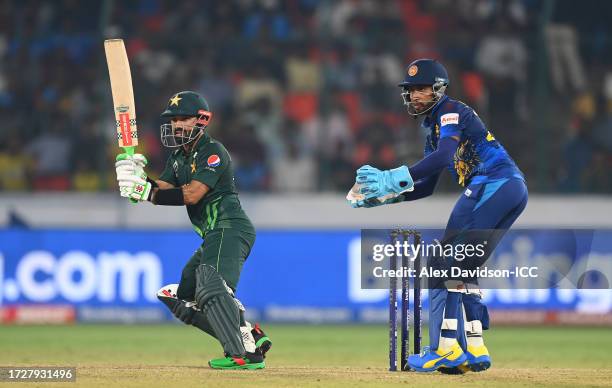 Mohammad Rizwan of Pakistan plays a shot as Kusal Mendis of Sri Lanka keeps during the ICC Men's Cricket World Cup India 2023 between Pakistan and...