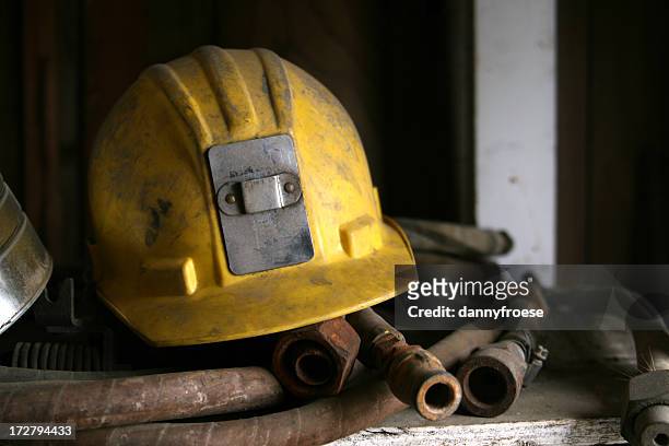yellow construction/mining hemet - mining helmet stock pictures, royalty-free photos & images