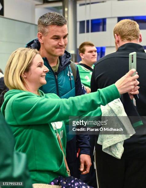 Dublin , Ireland - 16 October 2023; Captain Jonathan Sexton poses for a selfie with supporters on the Ireland rugby teams arrival at Dublin Airport...