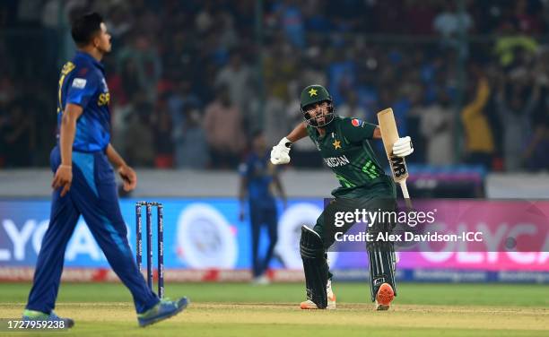 Abdullah Shafique of Pakistan celebrates their century during the ICC Men's Cricket World Cup India 2023 between Pakistan and Sri Lanka at Rajiv...