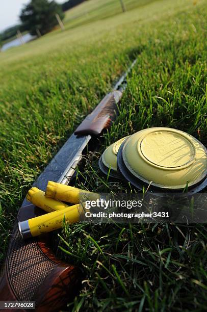 shotgun, shells, and clay pigeons - skeet shooting stock pictures, royalty-free photos & images