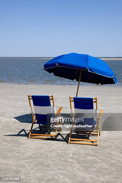 beach chairs and umbrella - st simons island stock pictures, royalty-free photos & images