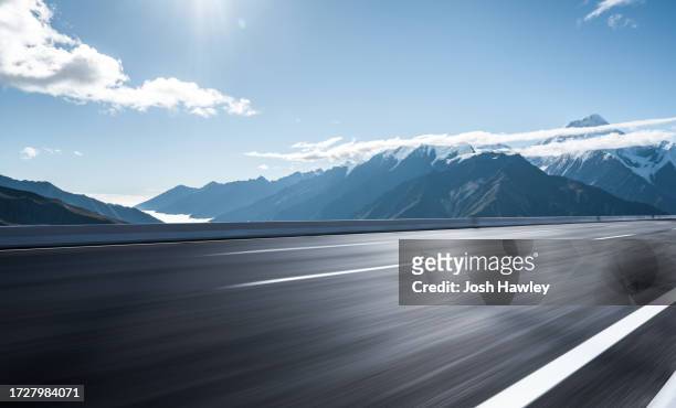 snowy mountain road - road stock pictures, royalty-free photos & images