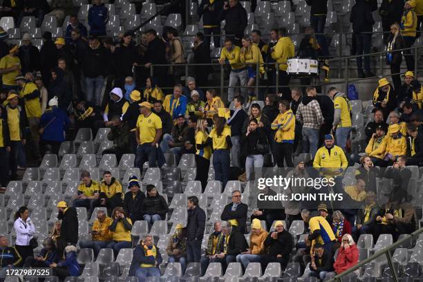 Swedish supporters wait in the stand during the Euro 2024 qualifying football match between Belgium and Sweden at the King Baudouin Stadium in...