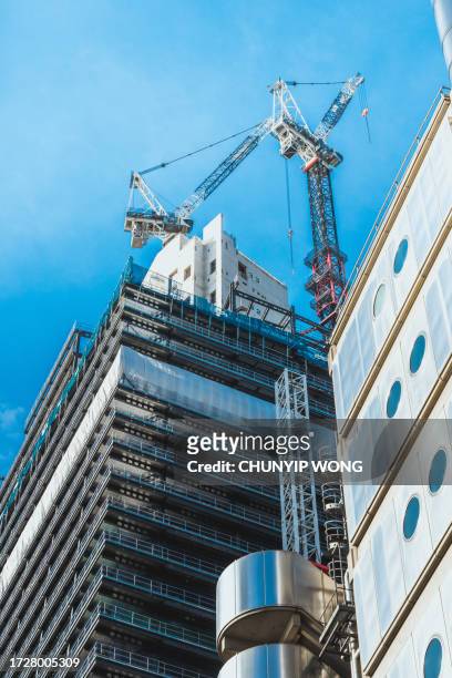 skyscrapers and construction site in london - commercial real estate as investment increases stock pictures, royalty-free photos & images