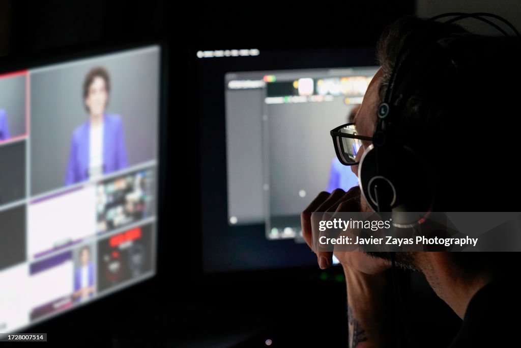 Television Producer Working During Filming