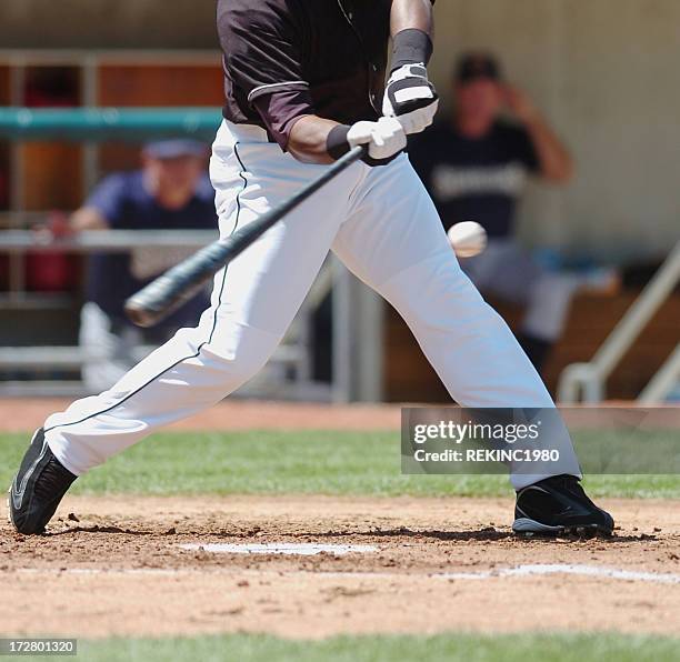 baseball player swings for the fences. - high school baseball stock pictures, royalty-free photos & images
