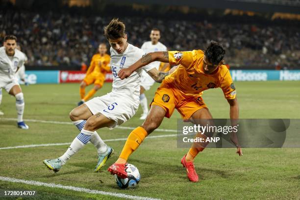 Lazaros Rota of Greece, Tijjani Reijnders of Holland during the European Championship qualifying match in group B between Greece and the Netherlands...