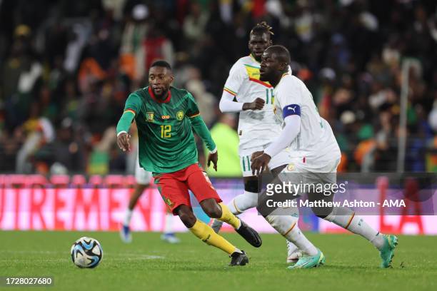 Karl Toko Ekambi of Cameroon and Kalidou Koulibaly of Senegal during the International Friendly match between Senegal and Cameroon at Stade...