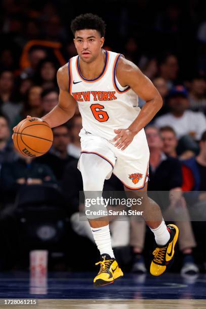 Quentin Grimes of the New York Knicks dribbles during the second half of a preseason game against the Boston Celtics at Madison Square Garden on...