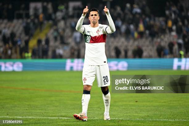 Portugal's defender Joao Cancelo greets the fans following the UEFA Euro 2024 Group J qualification football match Bosnia-Herzegovina v Portugal at...