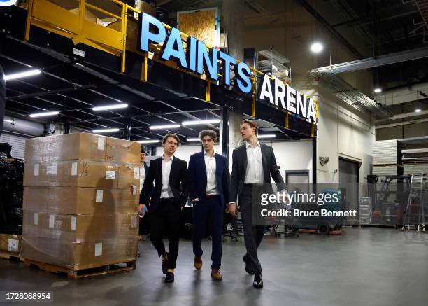 Connor Bedard, Kevin Korchinski and Alex Vlasic of the Chicago Blackhawks arrive for the morning skate prior to playing against the Pittsburgh...