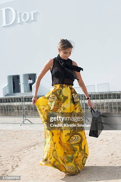 Brand Consultant Wilma Helena Faisson wears Christian Louboutin shoes, a Hermes bag, Mixed top, Custom made skirt and Dior headpiece on day 1 of...