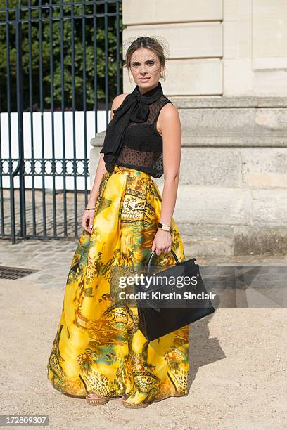 Brand Consultant Wilma Helena Faisson wears Christian Louboutin shoes, a Hermes bag, Mixed top, Custom made skirt and Dior headpiece on day 1 of...