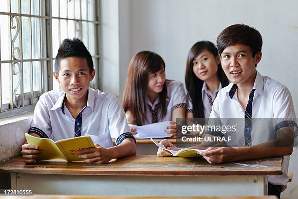 four of high school students in the classroom - vietnam teen stock-fotos und bilder