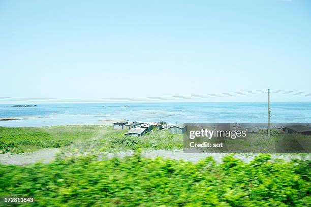 view of sea from the train window - tohoku stockfoto's en -beelden