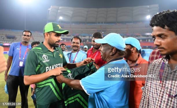 Babar Azam of Pakistan interacts with the groundstaff following the ICC Men's Cricket World Cup India 2023 between Pakistan and Sri Lanka at Rajiv...