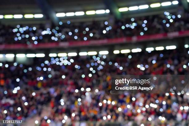 Fans with lights to show their support after the horrible murder on multiple Swedish fans during the Group F - UEFA EURO 2024 European Qualifiers...