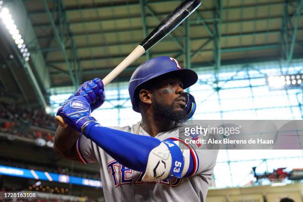 Adolis Garcia of the Texas Rangers warms up before Game 2 of the ALCS between the Texas Rangers and the Houston Astros at Minute Maid Park on Monday,...