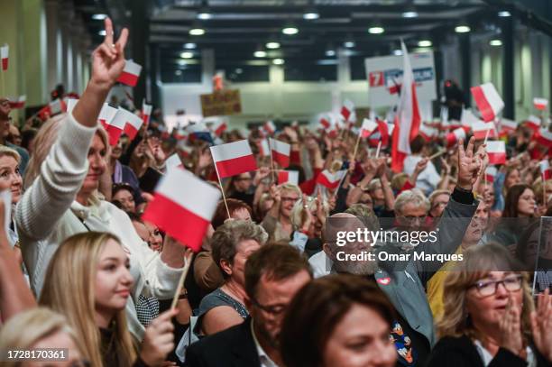 Members of the public gesticulate as the Leader of Civic Coalition Party, Donald Tusk delivers a speech during the Women for Elections Campaign rally...