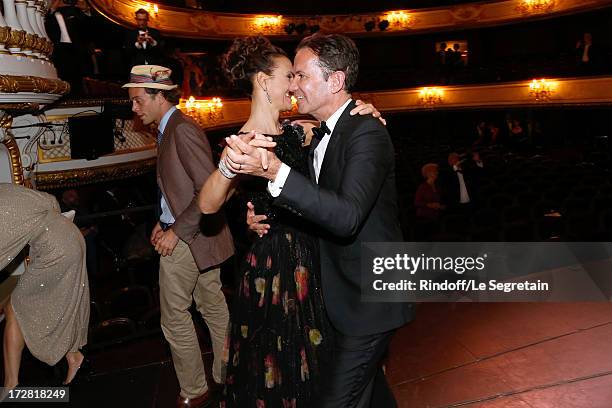 Actress Carole Bouquet and CEO Boucheron, Pierre Bouissou dancing on stage after a Show written by Muriel Mayette and an auction of stage costumes...