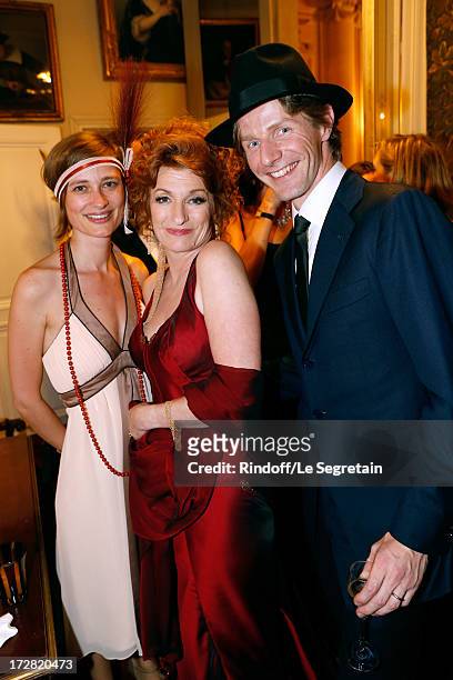 General administrator of Comedie Francaise Muriel Mayette standing between Star dancer Karl Paquette and wife Marion attend Le Grand Bal De La...
