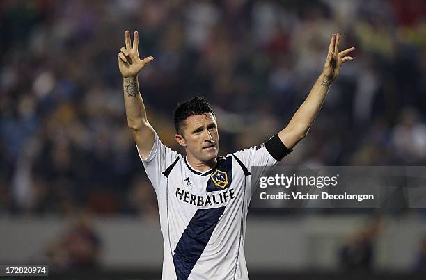 Robbie Keane of the Los Angeles Galaxy celebrates after converting his second penalty kick for a goal in the second half of the MLS match against the...