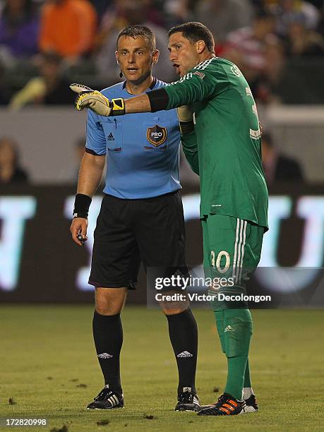 Goalkeeper Andy Gruenebaum of the Columbus Crew argues with referee Sorin Stoica on a foul called in the goal box by Stoica in the second half of the...