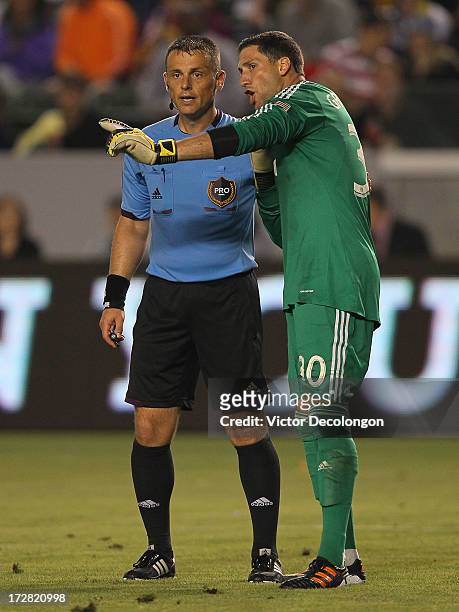 Goalkeeper Andy Gruenebaum of the Columbus Crew argues with referee Sorin Stoica on a foul called in the goal box by Stoica in the second half of the...