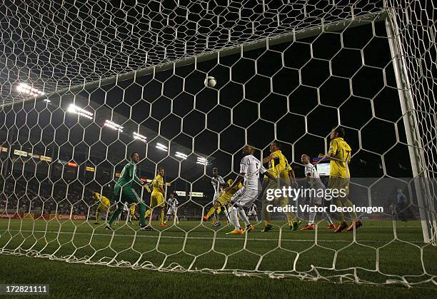 Sean Franklin of the Los Angeles Galaxy and goalkeeper Andy Gruenebaum of the Columbus Crew watch as a shot goes over the net in the second half of...