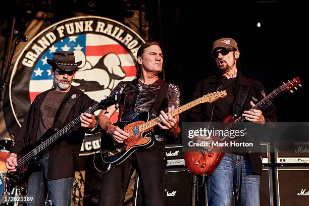 Mel Schacher, Max Carl and Bruce Kulick of Grand Funk Railroad perform on Day 1 of the RBC Royal Bank Bluesfest on July 4, 2013 in Ottawa, Canada.