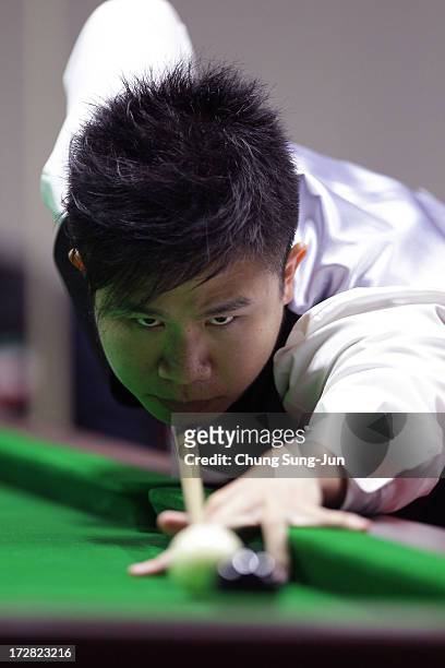 Chau Hom Man of Hong Kong plays a shot against Vafaei Ayouri Hossein of Iran during the Men's Snooker Round of 16 matches at Songdo Convensia during...