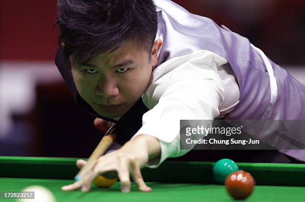 Chau Hom Man of Hong Kong plays a shot against Vafaei Ayouri Hossein of Iran during the Men's Snooker Round of 16 matches at Songdo Convensia during...