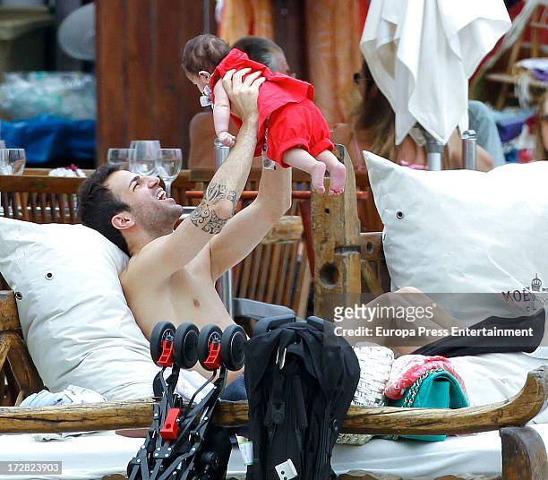 Barcelona football player Cesc Fabregas and his daughter Lia Fabregas are seen on July 4, 2013 in Ibiza, Spain.