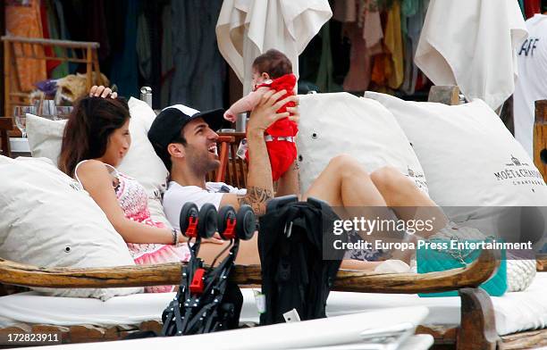 Barcelona football player Cesc Fabregas, his girlfriend Daniella Semaan and their daughter Lia Fabregas are seen on July 4, 2013 in Ibiza, Spain.