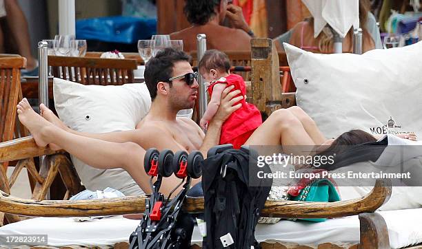 Barcelona football player Cesc Fabregas and his daughter Lia Fabregas are seen on July 4, 2013 in Ibiza, Spain.