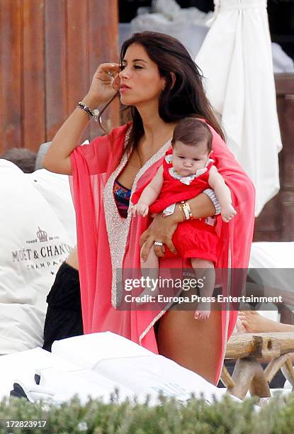 Barcelona football player Cesc Fabregas's girlfriend Daniella Semaan and her daughter Lia Fabregas are seen on July 4, 2013 in Ibiza, Spain.