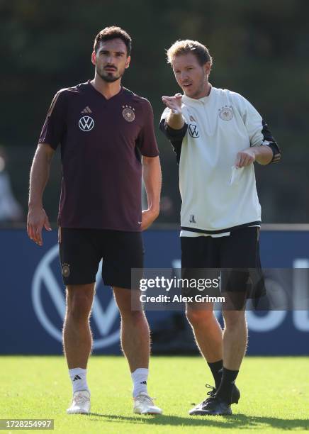 Julian Nagelsmann, head coach of Germany gives instructions to Mats Hummels during a training session of the German national football team on October...