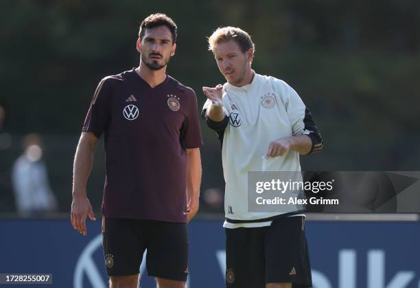 Julian Nagelsmann, head coach of Germany gives instructions to Mats Hummels during a training session of the German national football team on October...