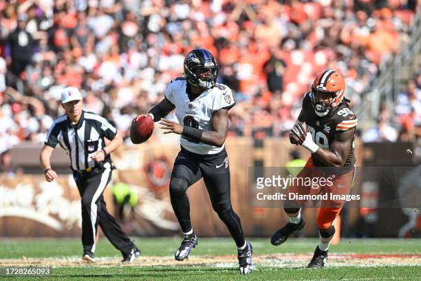 Lamar Jackson of the Baltimore Ravens looks to pass during the second half against the Cleveland Browns at Cleveland Browns Stadium on October 01,...