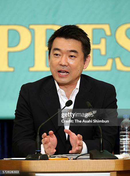 Japan Restoration Party co-leader Toru Hashimoto speaks during the party leaders debate at the Japan National Press Club on July 3, 2013 in Tokyo,...