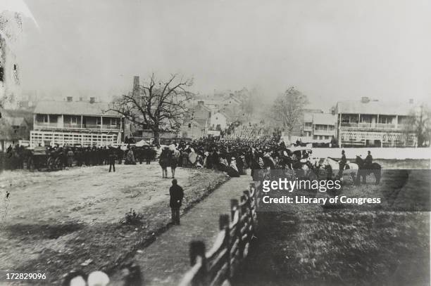 Crowds and marching troops on their way to the Soldiers' National Cemetery in Gettysburg, Pennsylvania, to hear US President Abraham Lincoln deliver...
