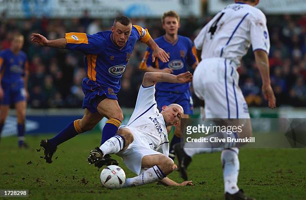 Thomas Gravesen of Everton tackles Luke Rodgers of Shrewsbury Town during the FA Cup Third Round match between Shrewsbury Town and Everton held on...