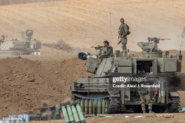 Artillery soldiers prepare around their armoured vehicles on October 10, 2023 in Netivot, Israel. Israel has sealed off Gaza and conducted airstrikes...