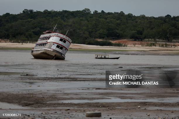 Ferry boat is seen stranded at the Marina do Davi, a docking area of the Negro river, city of Manaus, Amazonas State, northern Brazil, on October 16,...