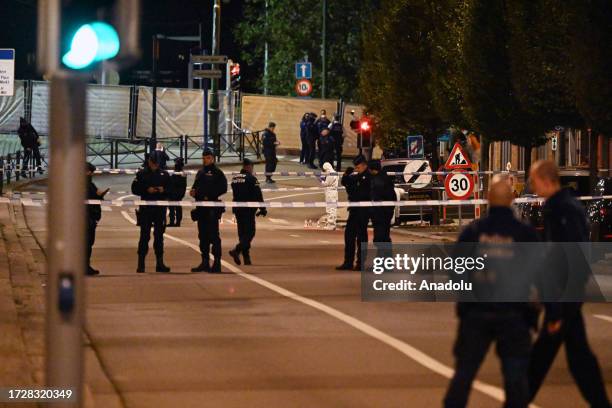 Police cordon off the area and take security measures around the King Baudouin Stadium after a gunman killed at least two Swedish nationals in...