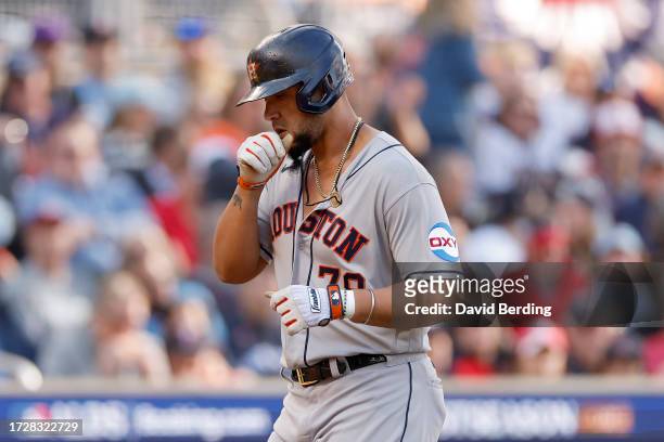 José Abreu of the Houston Astros rounds the bases after hitting a home run in the first inning against the Minnesota Twins during Game Three of the...