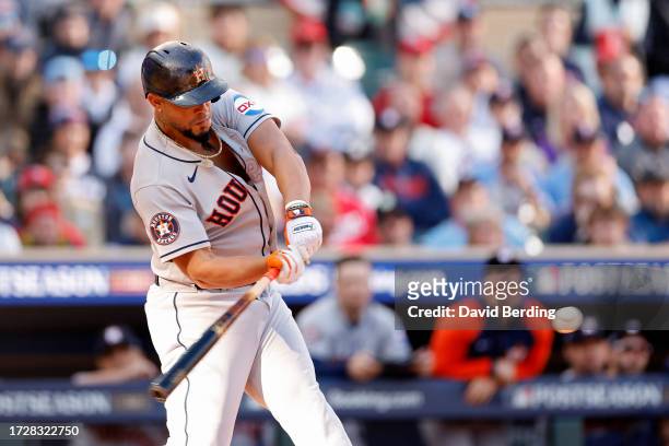 José Abreu of the Houston Astros hits a home run in the first inning against the Minnesota Twins during Game Three of the Division Series at Target...