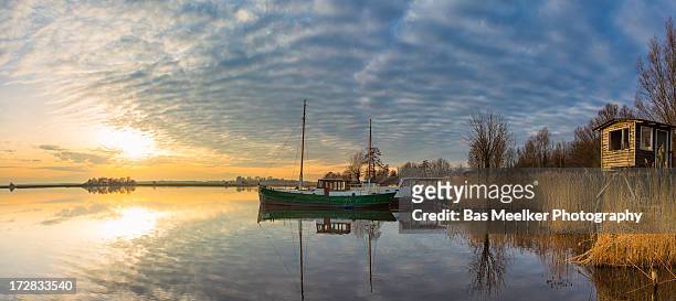 late winter sun at the lake - drenthe stock pictures, royalty-free photos & images