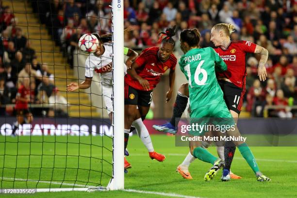 Melvine Malard of Manchester United scores the team's first goal past Constance Picaud of Paris Saint-Germain Feminine during the UEFA Women's...